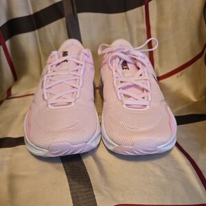 Nike Legend Essential 3 in Pink Foam and Dark Team Red